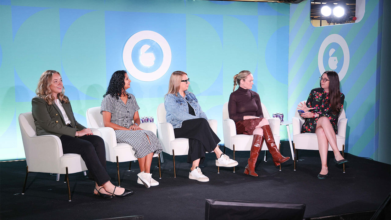 Speaker on the stage at Ad week new your panel titled "Navigating Economic Headwinds: Maximizing Ad Spend Through Smarter Measurement.