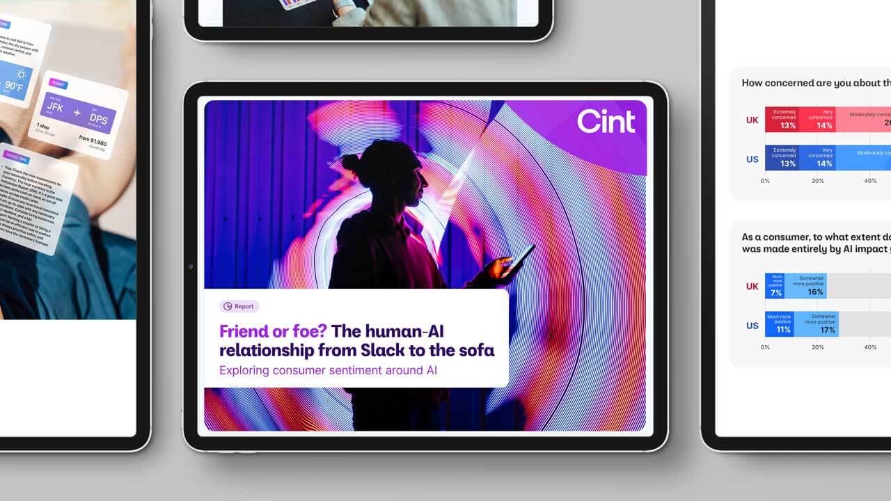 Digital tablet screens showcasing Cint market research insights into the human-AI relationship and consumer sentiment across the UK and US markets.
