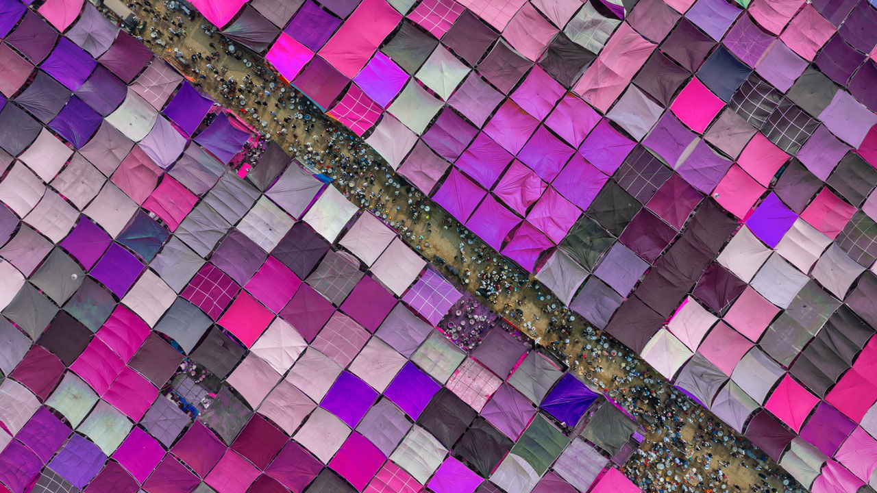 A geometric pattern of purple market stalls from above, illustrating a diverse ecosystem of data suppliers and respondents within a unified research platform.