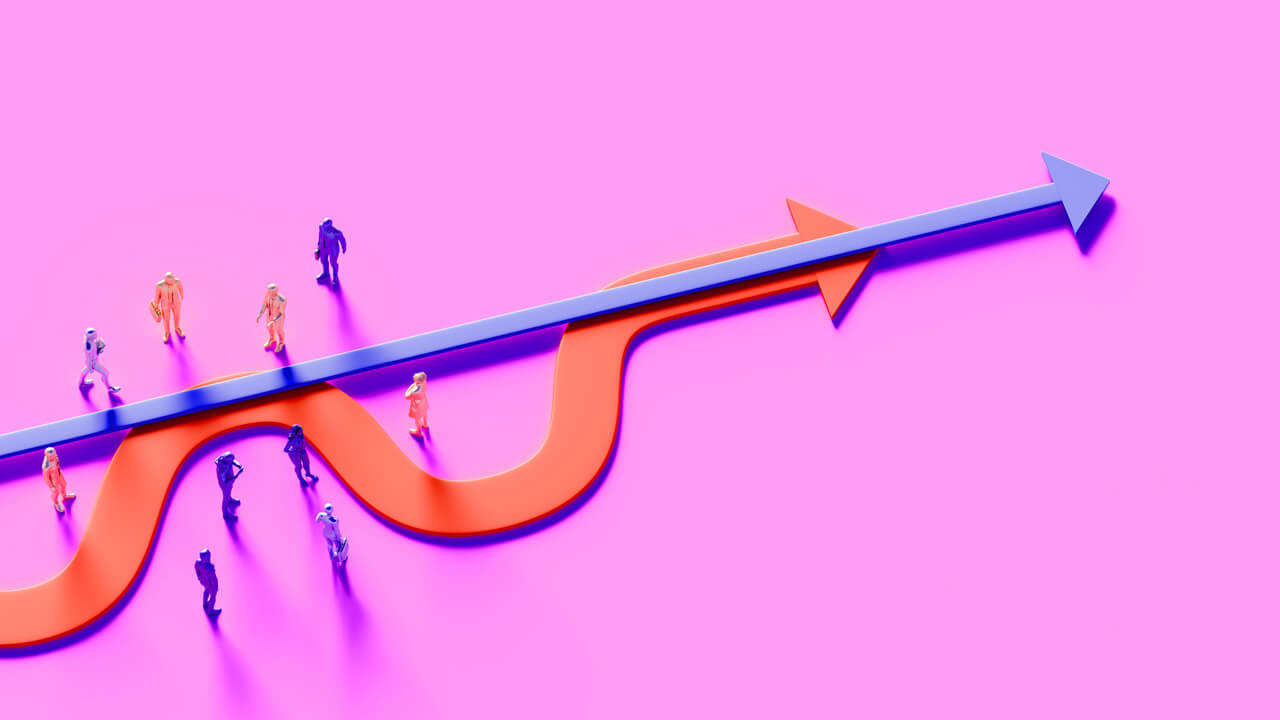 An illustration set on a bright pink background featuring a straight blue directional arrow passing over a winding orange curved arrow, with miniature human figures stationed along both paths, representing Cint's guide on how to choose a market research panel provider